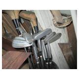 2 Sets of golf clubs, one has wood ...