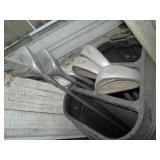 2 Sets of golf clubs, one has wood ...