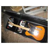 Squire electric guitar in a hardshe...