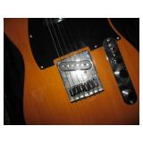 Squire electric guitar in a hardshe...