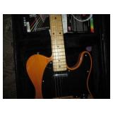 Squire electric guitar in a hardshe...