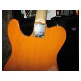 Squire electric guitar in a hardshe...