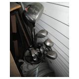 Set of golf clubs in a case...