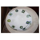 Stack of dinner plates and decorati...