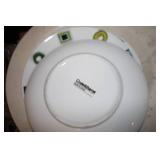 Stack of dinner plates and decorati...