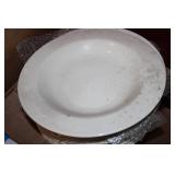 Stack of dinner plates and decorati...