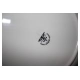 Stack of dinner plates and decorati...