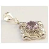 925 sterling silver pendant with faceted purple stone ornate floral setting