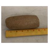Primitive stone pestle / handheld grinding tool, brown sandstone, approx 6 inch long, rustic display