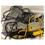 Assorted Power Strips Surge Protectors Extension Cords Basket with Tripp Lite Outlet Bar