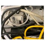 Assorted Power Strips Surge Protectors Extension Cords Basket with Tripp Lite Outlet Bar