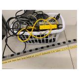 Assorted Power Strips Surge Protectors Extension Cords Basket with Tripp Lite Outlet Bar