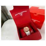 Swiss Legend Planeter Pink Dial Gold Tone Case White Strap Women