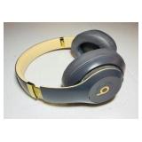 BEATS Wireless Studio3 Noise Cancelling headphones grey & tan in color.