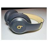 BEATS Wireless Studio3 Noise Cancelling headphones grey & tan in color.