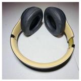 BEATS Wireless Studio3 Noise Cancelling headphones grey & tan in color.