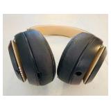 BEATS Wireless Studio3 Noise Cancelling headphones grey & tan in color.