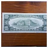 1977 $10 Federal Reserve Note :: Very Fine condition in protective plastic slip
