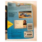 Four 1:64 Scale Diecast Race Cars