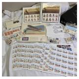 Large lot of stamps, including one bag of unused USA stamps.