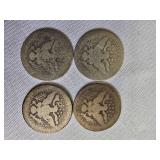 Four Barber Quarters with a face value of one dollar: 1894-P, 1902-O,1907-P & 1912-P