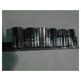 6pc 1/2in drive SAE sockets on rail...