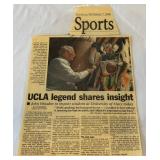 John Wooden Autographed Newspaper Article, Laminated