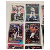 Lot of 14 Baseball Rookie Cards Featuring Adley Rutschman, Evan Carter, and Colton Cowser. Includes various brands with special features like holographic and holiday designs.