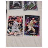 Lot of 14 Baseball Rookie Cards Featuring Adley Rutschman, Evan Carter, and Colton Cowser. Includes various brands with special features like holographic and holiday designs.