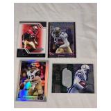 Lot of 4 Numbered Football Cards Featuring Kurt Warner, Marshall Faulk, Devery Henderson, and Patrick Willis