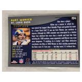 Lot of 4 Numbered Football Cards Featuring Kurt Warner, Marshall Faulk, Devery Henderson, and Patrick Willis