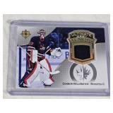 Connor Hellebuyck GOLD MEDAL GOALIE 2022-23 Upper Deck Ultimate Jersey Tendys Memorabilia #UT-CH - Winnipeg Jets Hockey Card