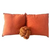 BR1 - Two Orange Textured Throw Pillows & Knot Pillow