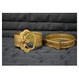 (2) metal bracelets...