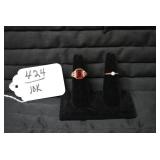 Ladies rings, one with red stone is...