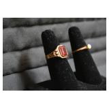 Ladies rings, one with red stone is...