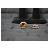 Ladies rings, one with red stone is...