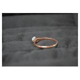 Ladies rings, one with red stone is...