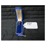 Lapel pin in blue box...