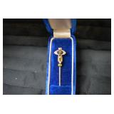 Lapel pin in blue box...