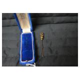 Lapel pin in blue box...