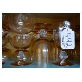 Stemware, various sizes. Light ambe...