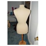 Mannequin on wood base...