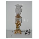 Brass electric lamp with cherub fig...
