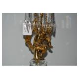 Brass electric lamp with cherub fig...