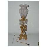 Brass electric lamp with cherub fig...