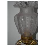 Brass electric lamp with cherub fig...