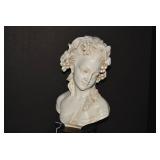 Bust of young maiden with leaves an...