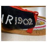 Native American beaded leather slip...