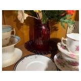 Red glass with cup and saucer colle...